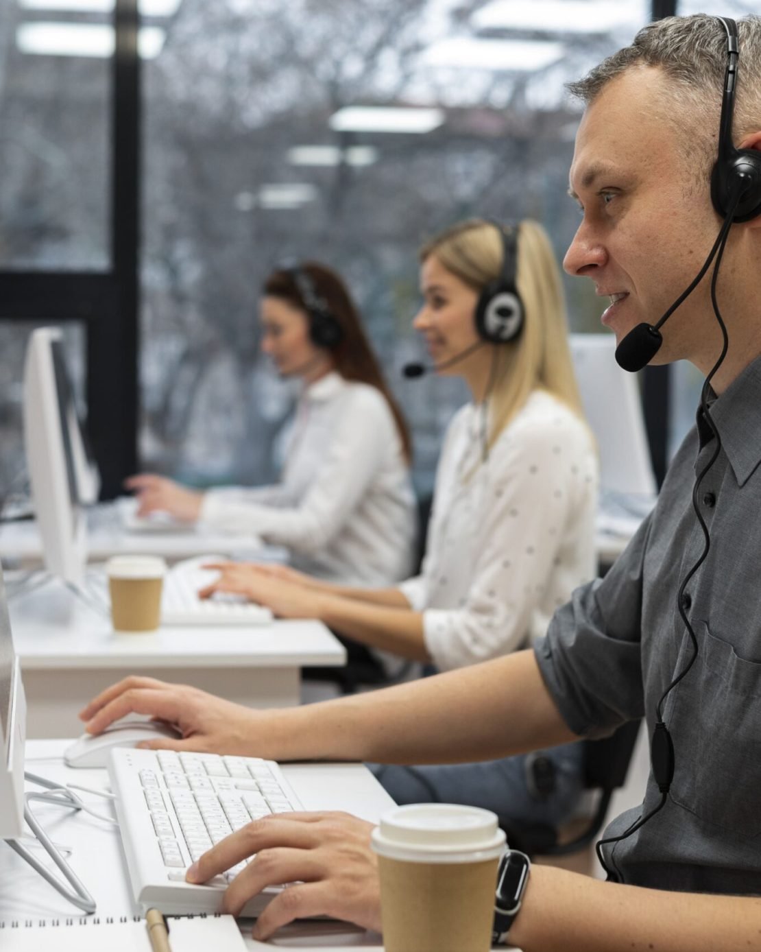 colleagues-working-together-call-center-office-with-coffee
